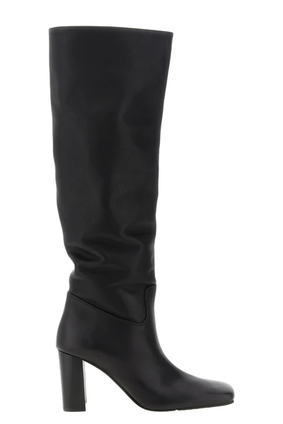 the khaite petra boot redefines vertical elegance through a rigorous silhouett