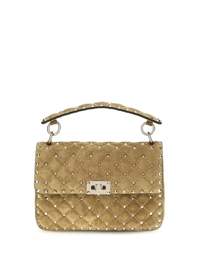 medium rockstud spike suede top handle bag