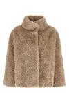 the herno short coat defines a boxy silhouette through a rigorous sartorial cons