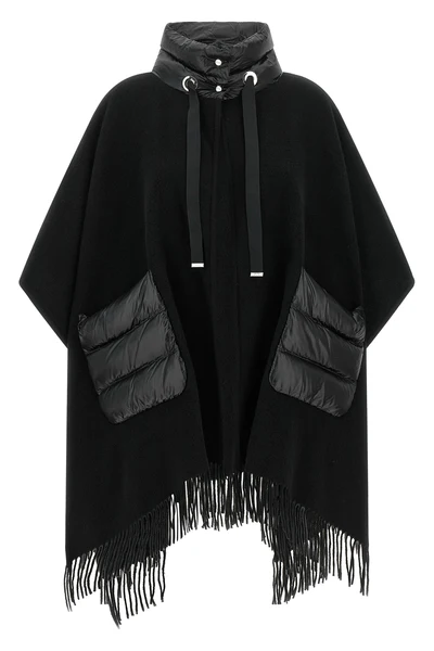 the herno resort poncho redefines the codes of outerwear through a sophisticat