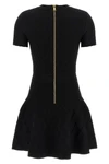 the flared balmain skater dress redefines knitwear codes through an hourglass