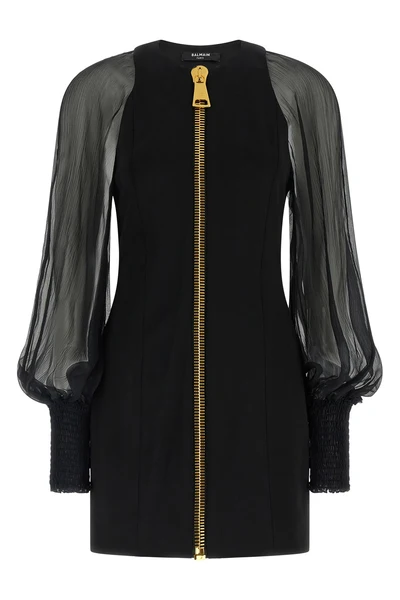 the balmain black mini dress redefines the codes of elegance through a sophistic