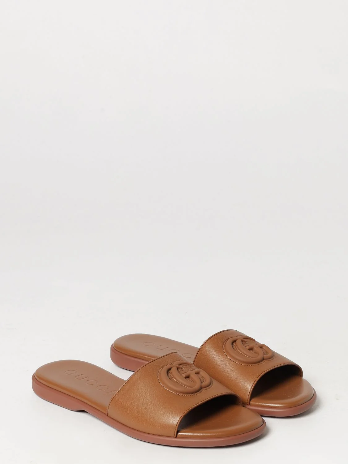 GUCCI 37 calfskin leather slides with embossed gg monogram