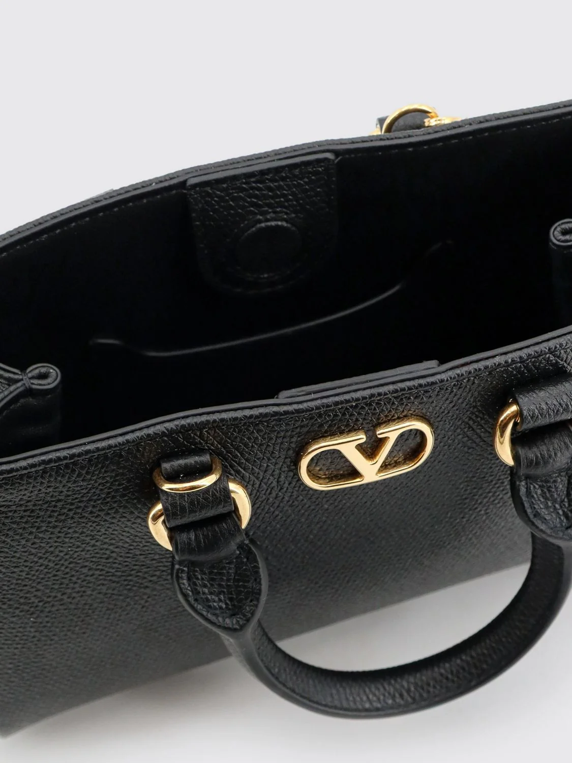 grained leather handbag with vlogo signature