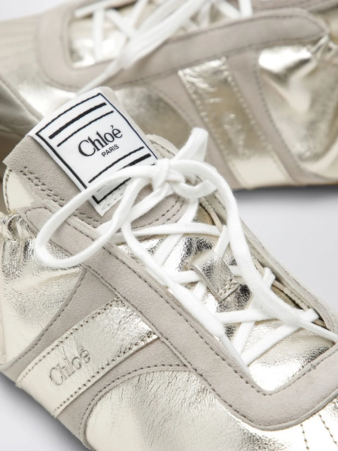 chloé kick low-top sneakers in a mix of smooth, suede, and laminated leather