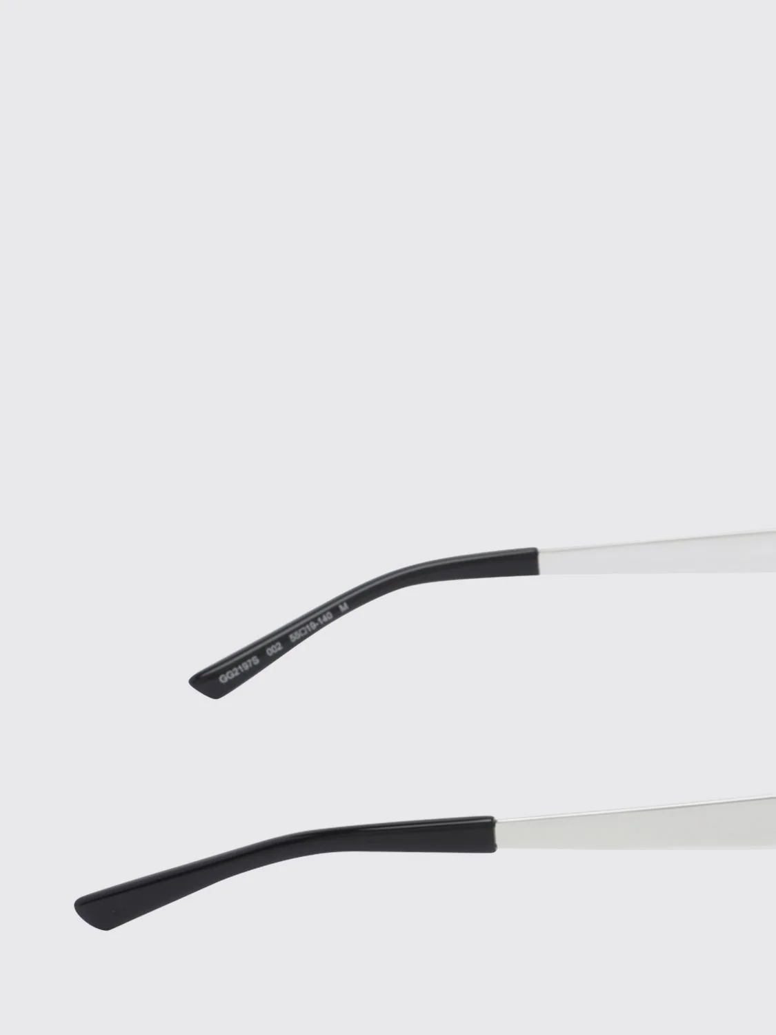 gold-tone metal cat-eye sunglasses with oval shape and gg logo