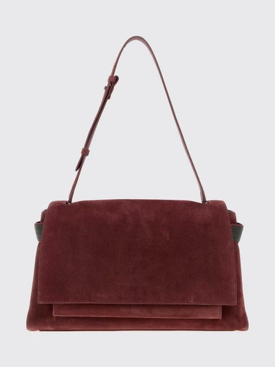 suede shoulder bag with monili embellishment