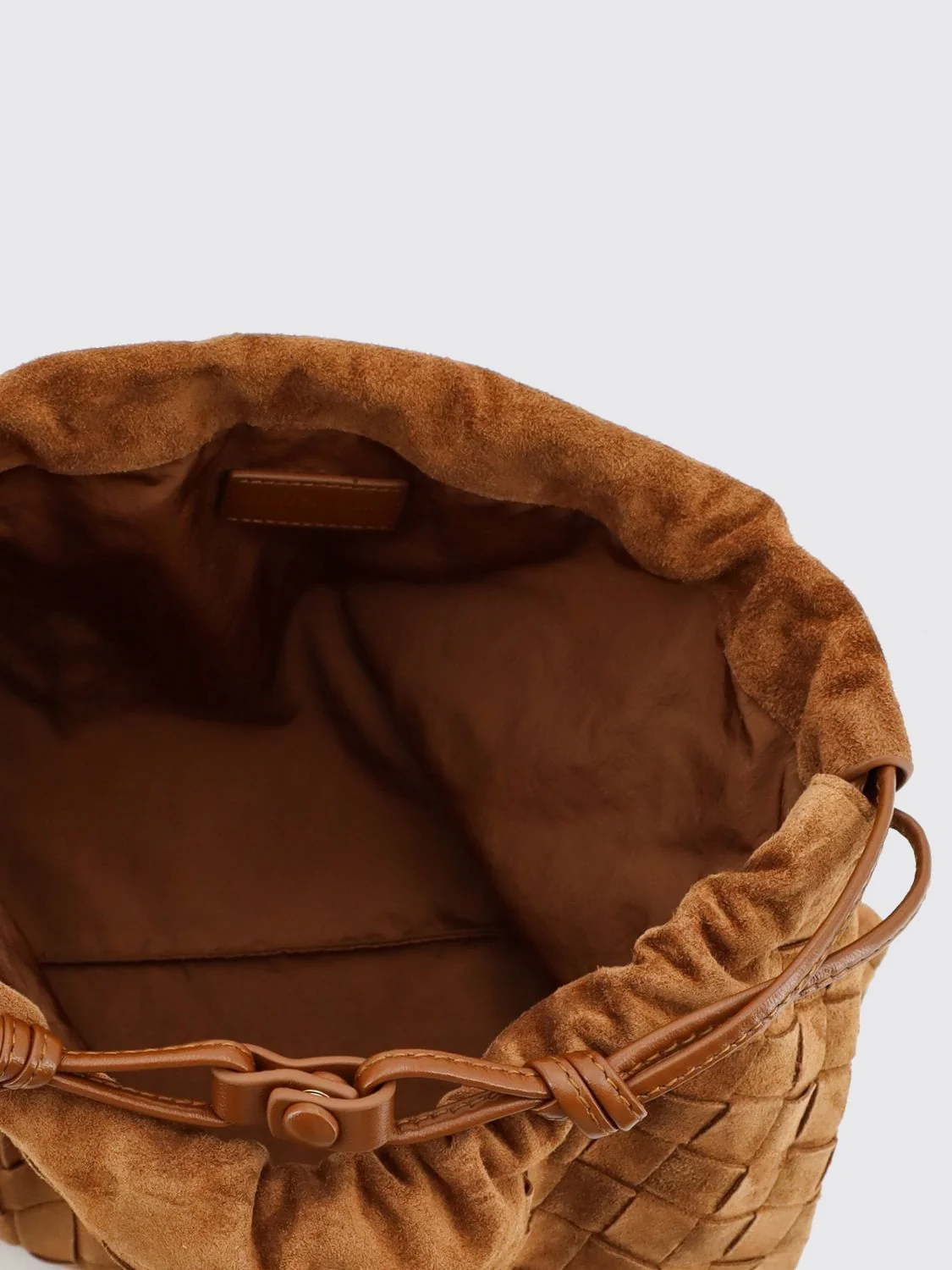 dustbag woven calfskin clutch with drawstring closure