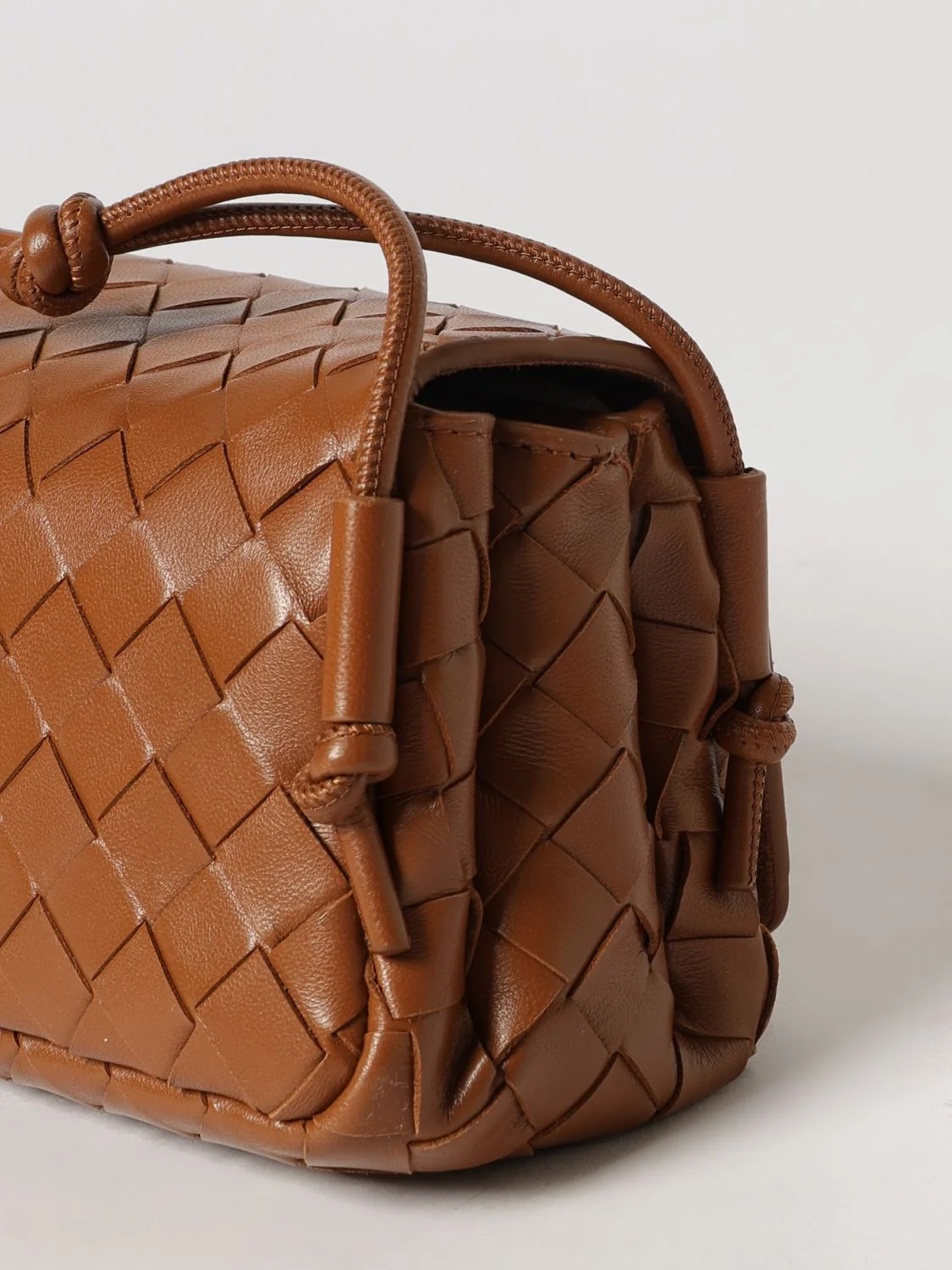 notturno woven leather shoulder bag with knotted strap
