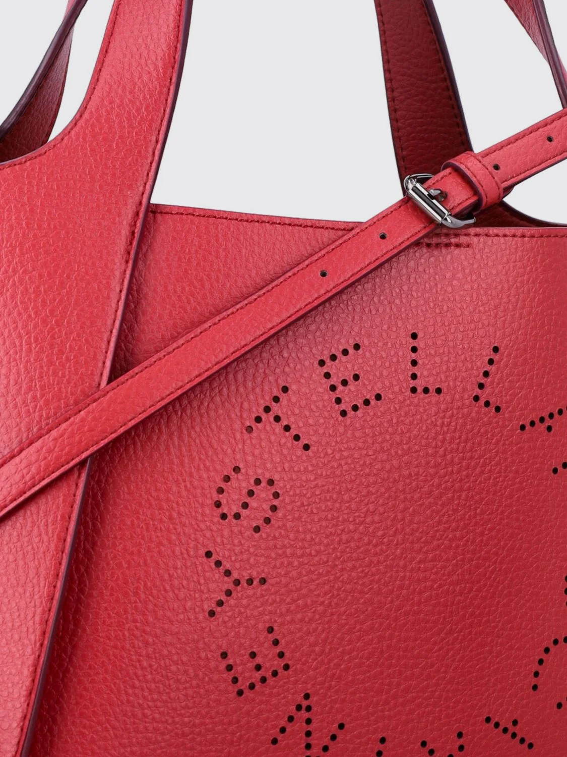 faux leather handbag with perforated logo and strap