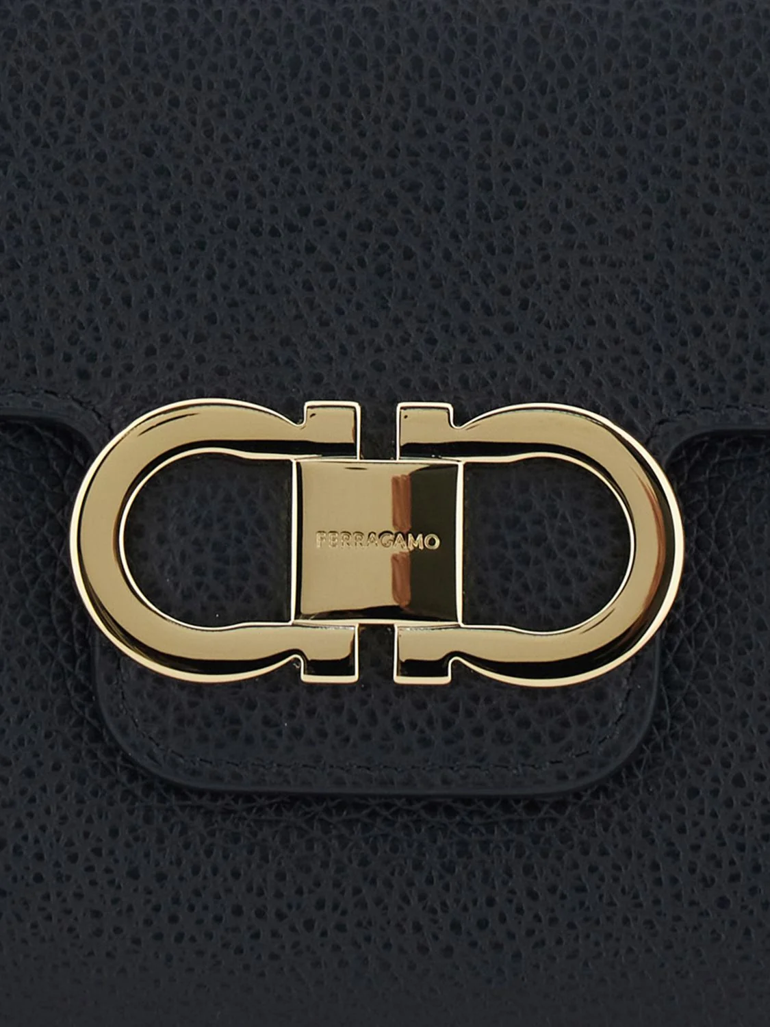 gancini pouch in grained calfskin with wrist strap