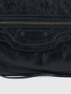 le city clutch in black arena lambskin leather with applied studs
