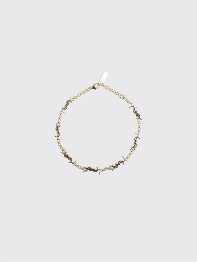 gold-tone metal bracelet with interlaced ysl monogram pendant