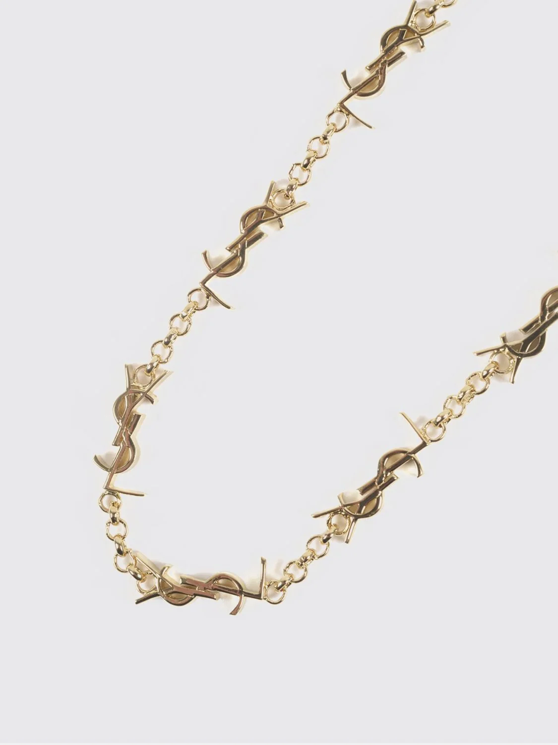 SAINT LAURENT M gold-tone metal bracelet with interlaced ysl monogram pendant
