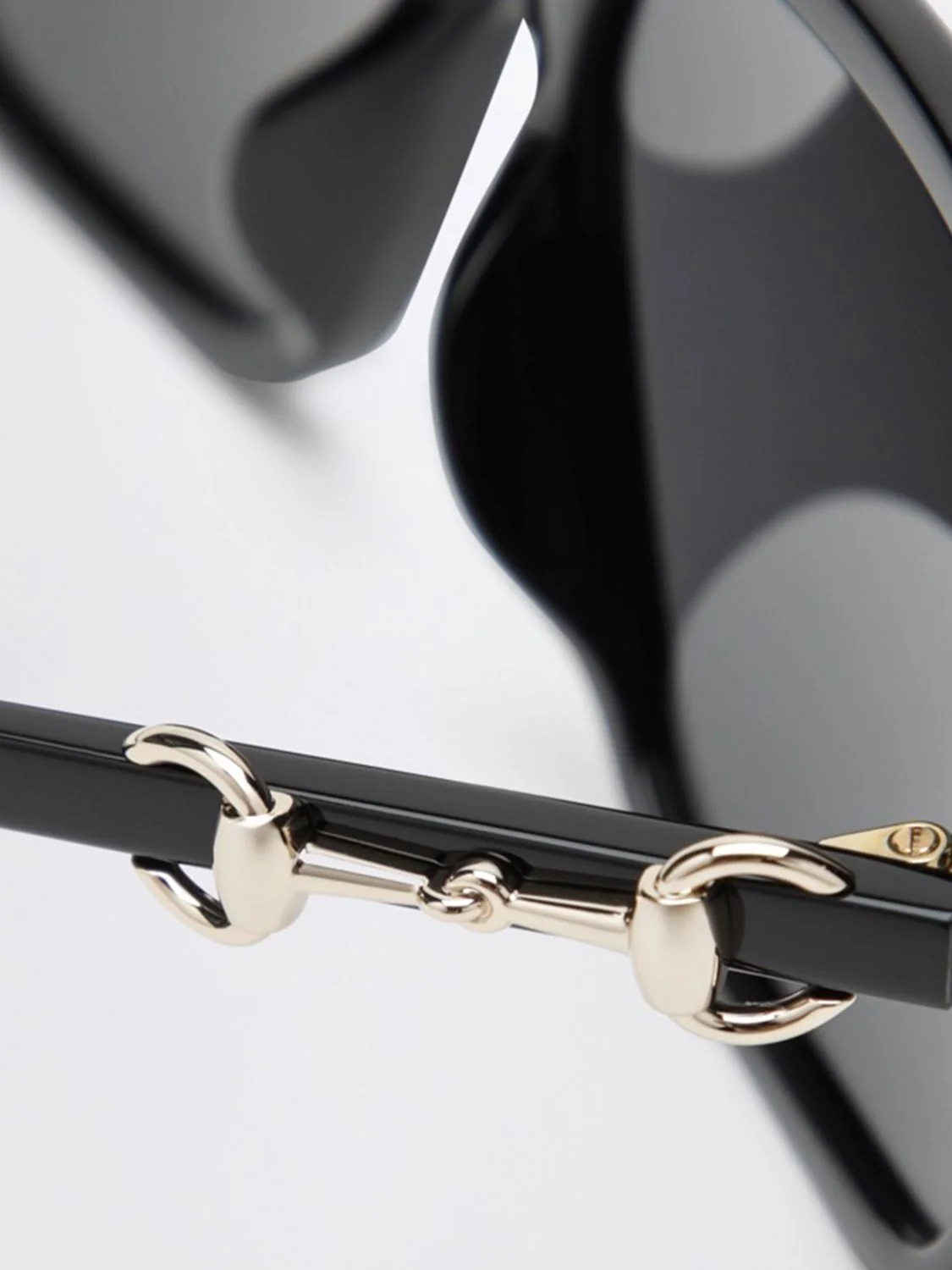 classic cat-eye sunglasses in black acetate with horsebit detail