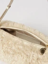 cylindrical shearling shoulder bag with adjustable handle