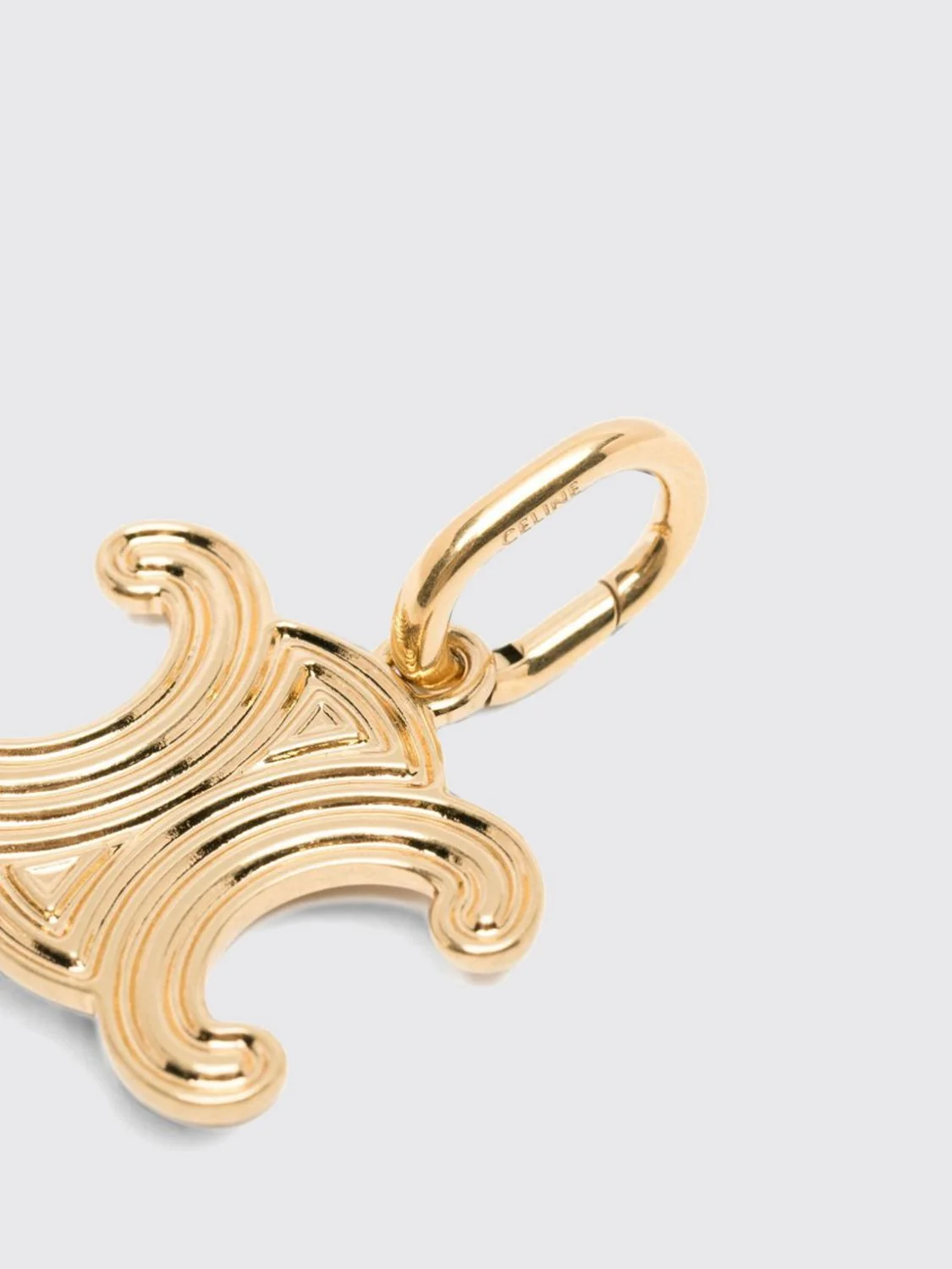 triomphe monogram pendant in two-tone gold and silver finish brass