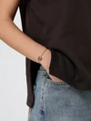 anagram brass bracelet with drawstring closure