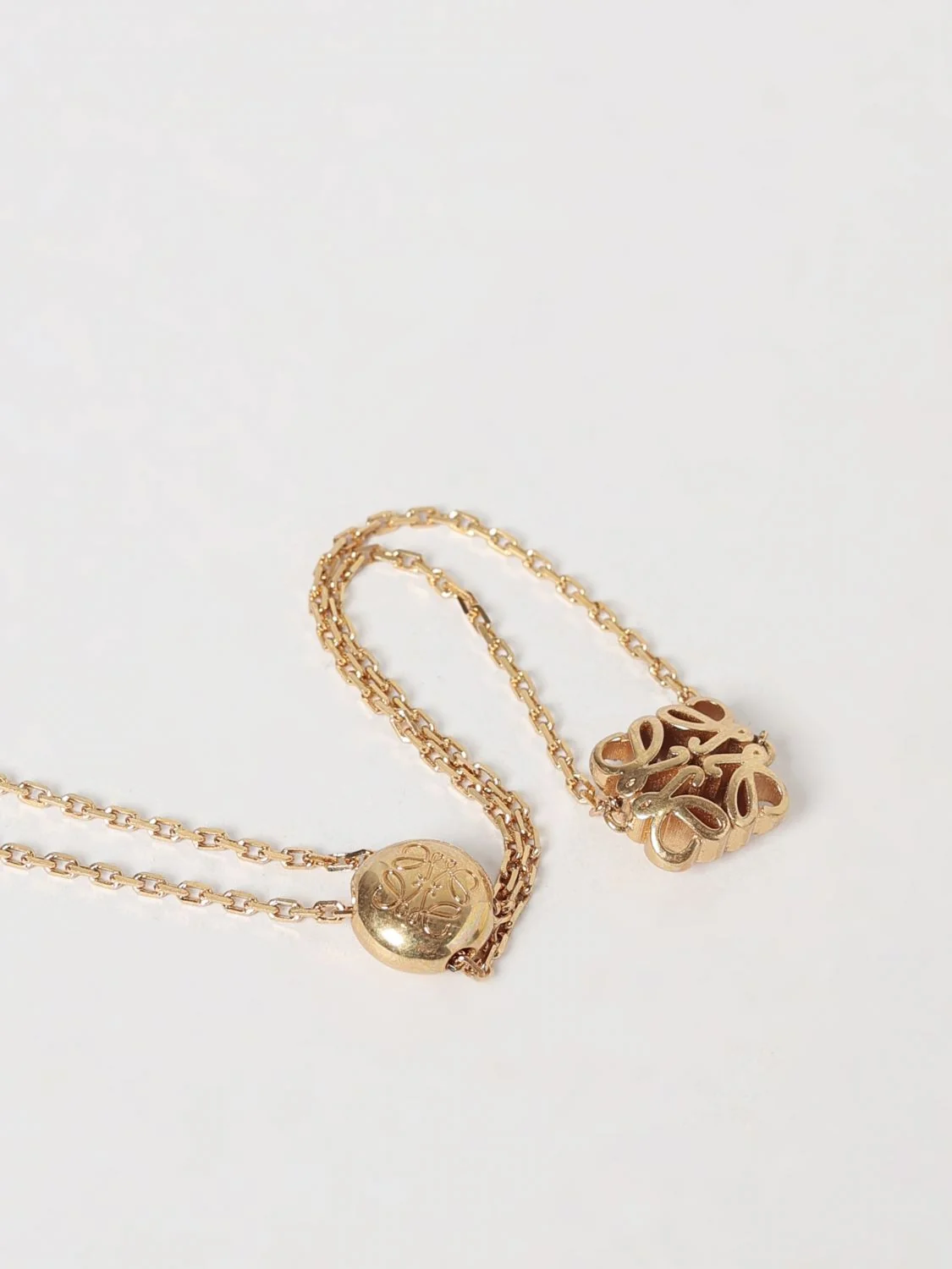 anagram brass bracelet with drawstring closure