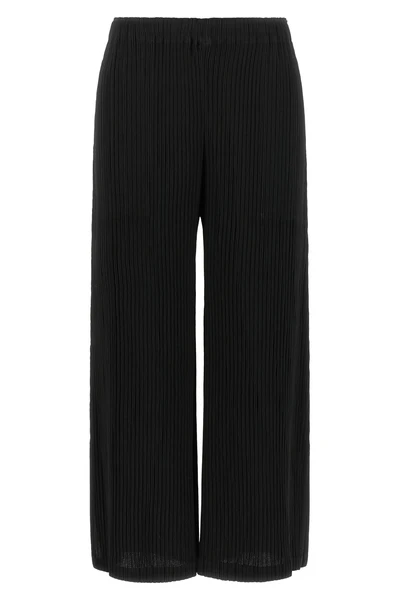 the hatching bottoms issey miyake trousers define a wide and fluid silhouette