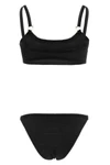 the hunza g iris bikini redefines beachwear aesthetics through an essential silh