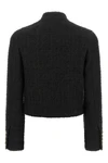 the balmain double-breasted tweed short jacket defines the wardrobe through a ri