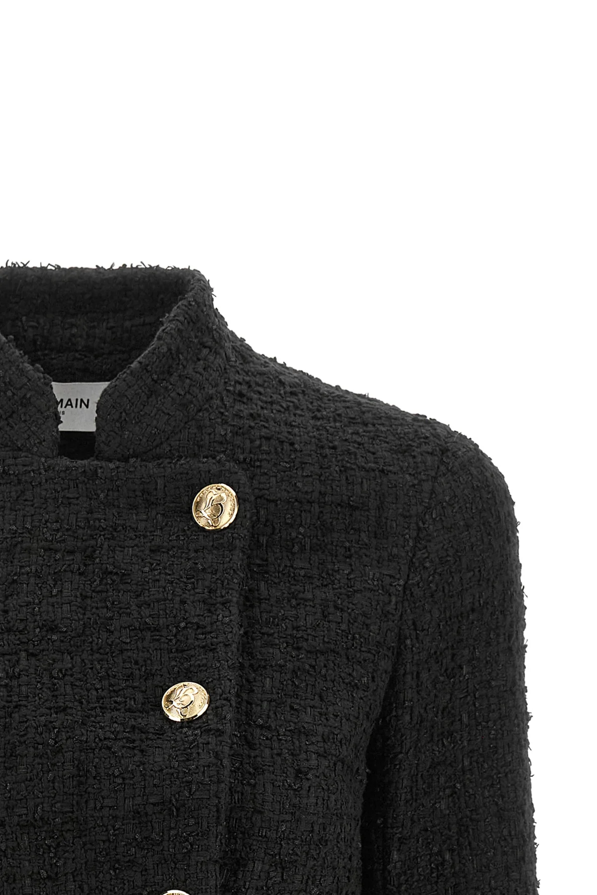 the balmain double-breasted tweed short jacket defines the wardrobe through a ri