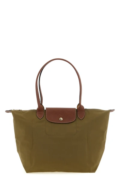 the longchamp le pliage original l shoulder bag is distinguished by a capaciou