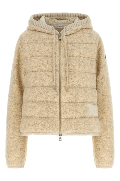 the moncler sweatshirt stands out for its hybrid construction that combines knit