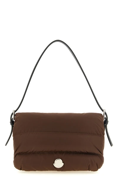 the moncler caradoc shoulder bag redefines the codes of outerwear through a bagu