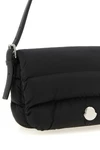 the moncler caradoc shoulder bag translates the brands iconic aesthetic into
