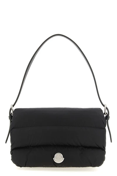 the moncler caradoc shoulder bag translates the brands iconic aesthetic into