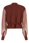 the brunello cucinelli blouse exemplifies the brands mastery in material contra