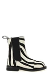 moschinos chelsea ankle boots redefine urban aesthetics through world-class man