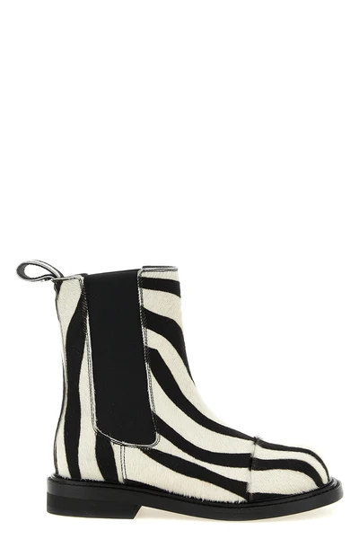 moschinos chelsea ankle boots redefine urban aesthetics through world-class man