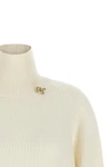 the fabiana filippi sweater sets a new standard in knitwear through a relaxed si