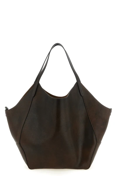 the brunello cucinelli shopping bag redefines everyday volumes through a destruc