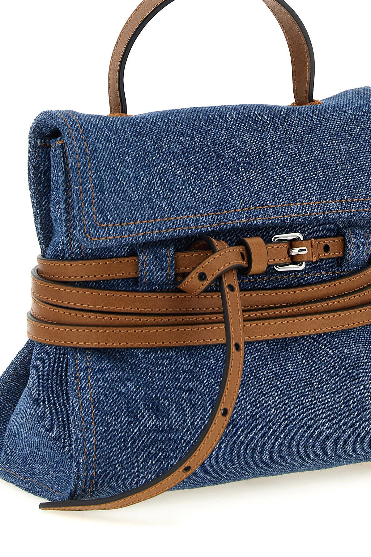 moschino tie me small denim handbag reinterprets urban codes through a contras