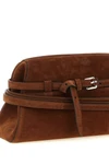 the moschino large tie me cutch in soft tobacco-colored suede stands out for i