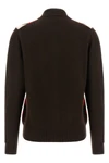 the miu miu cardigan redefines the codes of classic knitwear through a structure