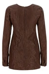 the miu miu dress defines a new sartorial aesthetic through a rigorous material