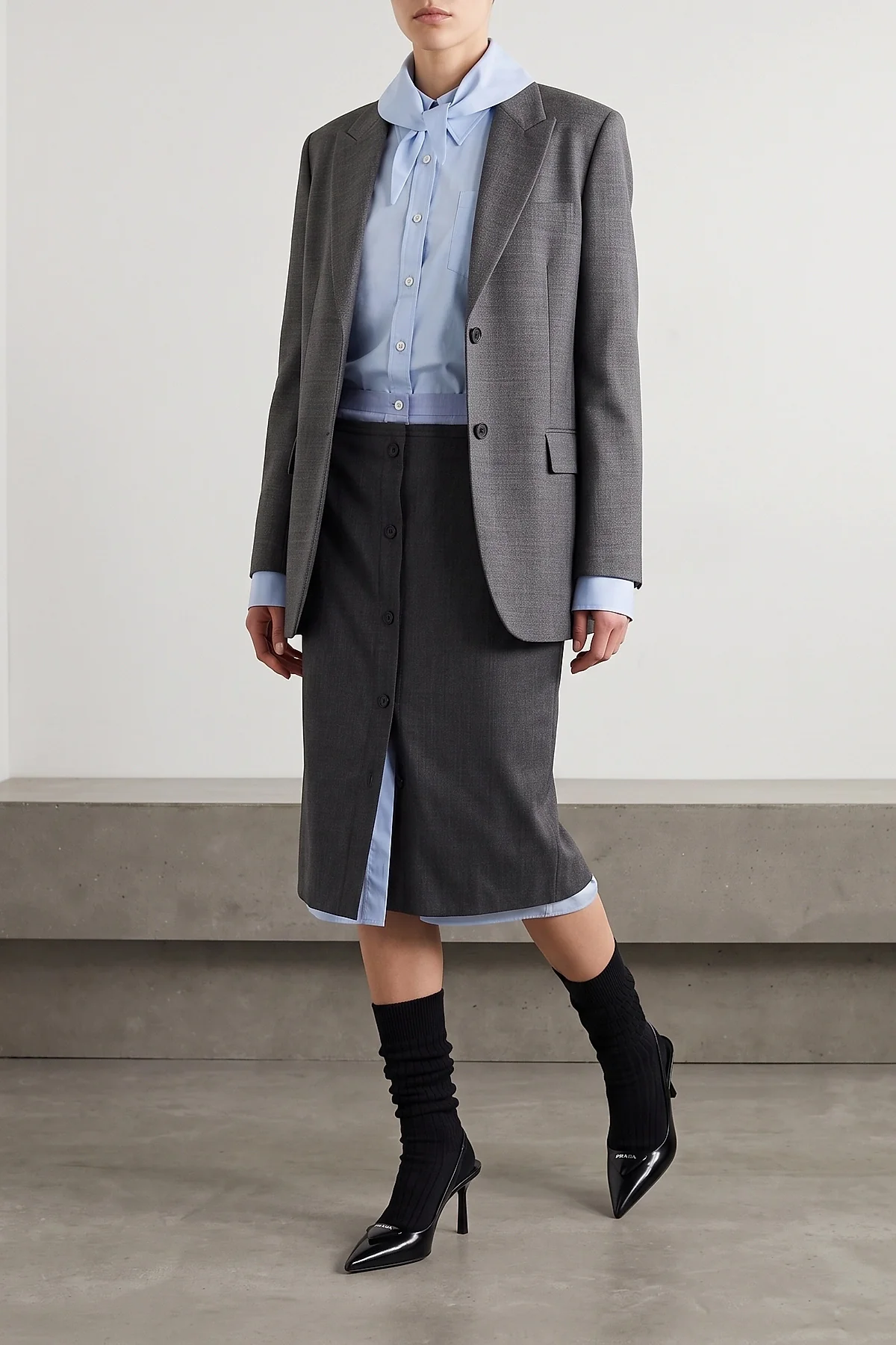 PRADA 38 the prada midi skirt in a fine virgin wool and mohair blend is distinguished by