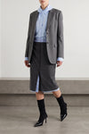 the prada midi skirt in a fine virgin wool and mohair blend is distinguished by