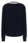 the prada cardigan in fine navy blue yarn embodies timeless elegance through une