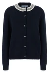 the prada cardigan in fine navy blue yarn embodies timeless elegance through une