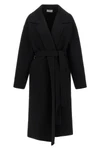 the row ciara coat redefines winter elegance through relaxed volumes and impecca