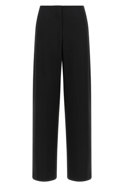 the row farah trousers embody the essence of sartorial minimalism through a wi
