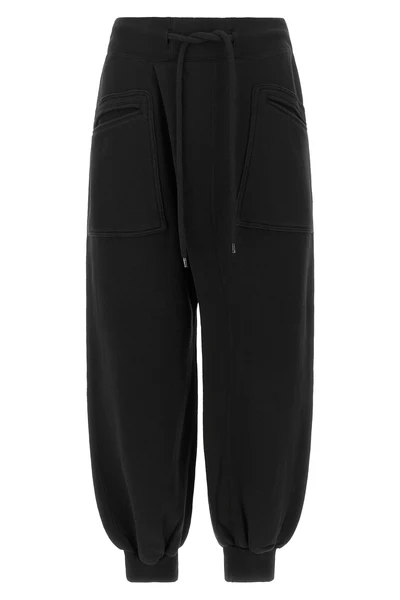 the r13 tracksuit pants redefine loungewear through bold proportions and a decon