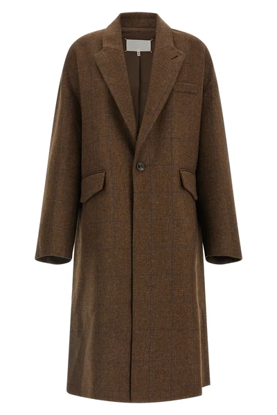 the maison margiela oversized cocooning coat redefines the proportions of the ou