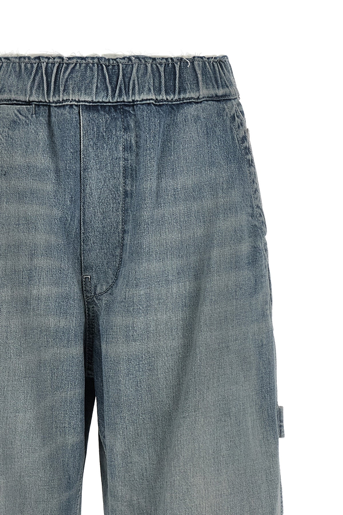 maison margiela mm6 jeans redefine workwear aesthetics through a wide-leg silhou